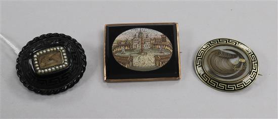 A 19th century Italian micro-mosaic brooch of St Peters and two Memento Mori brooches